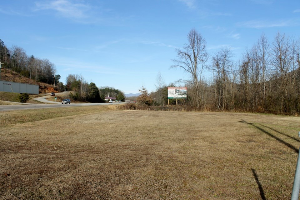 flat acerage to the side with road frontage