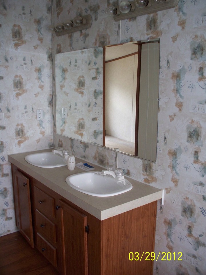master bath features double vanity and garden tub